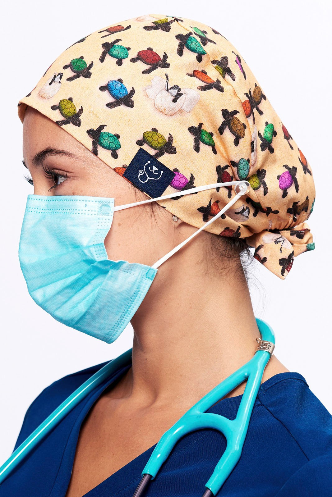 A Vet wearing a Dr. Woof Sea Turtle Surgical Scrub Cap
