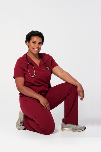 Dentist wearing a Dr. Scrub Uniform in Burgundy