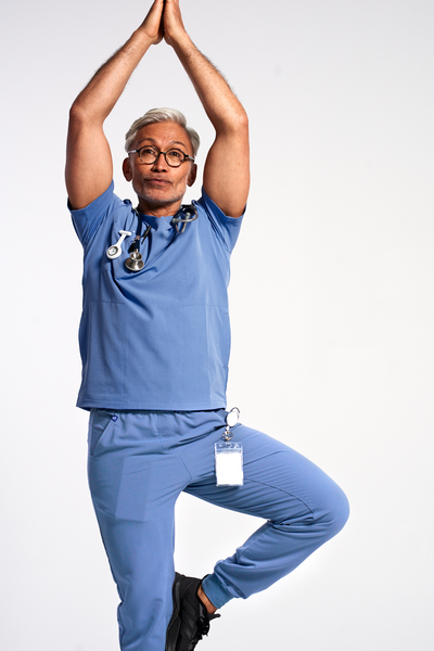Nurse wearing a Dr. Scrub Uniform in Ciel Blue 