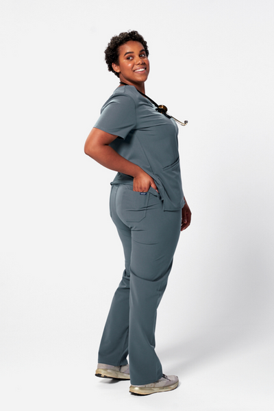 Vet Tech wearing a Dr. Scrub Uniform in Cool Gray 