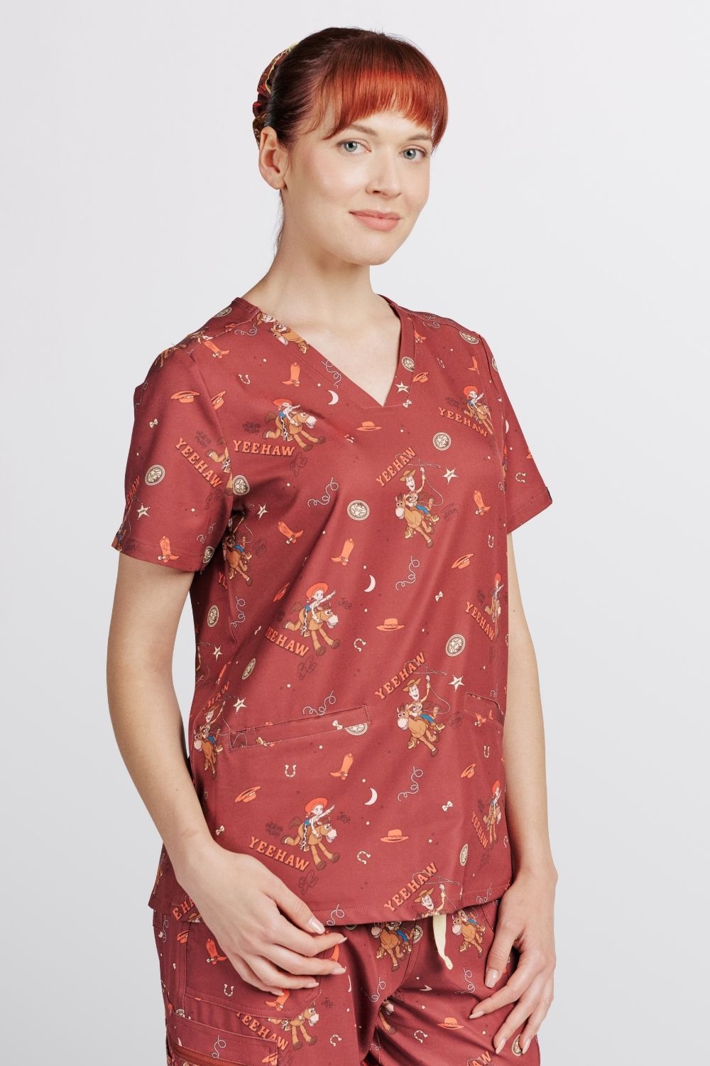 Disney’s Toy Story Women’s 3-Pocket Scrub Top, Yeehaw