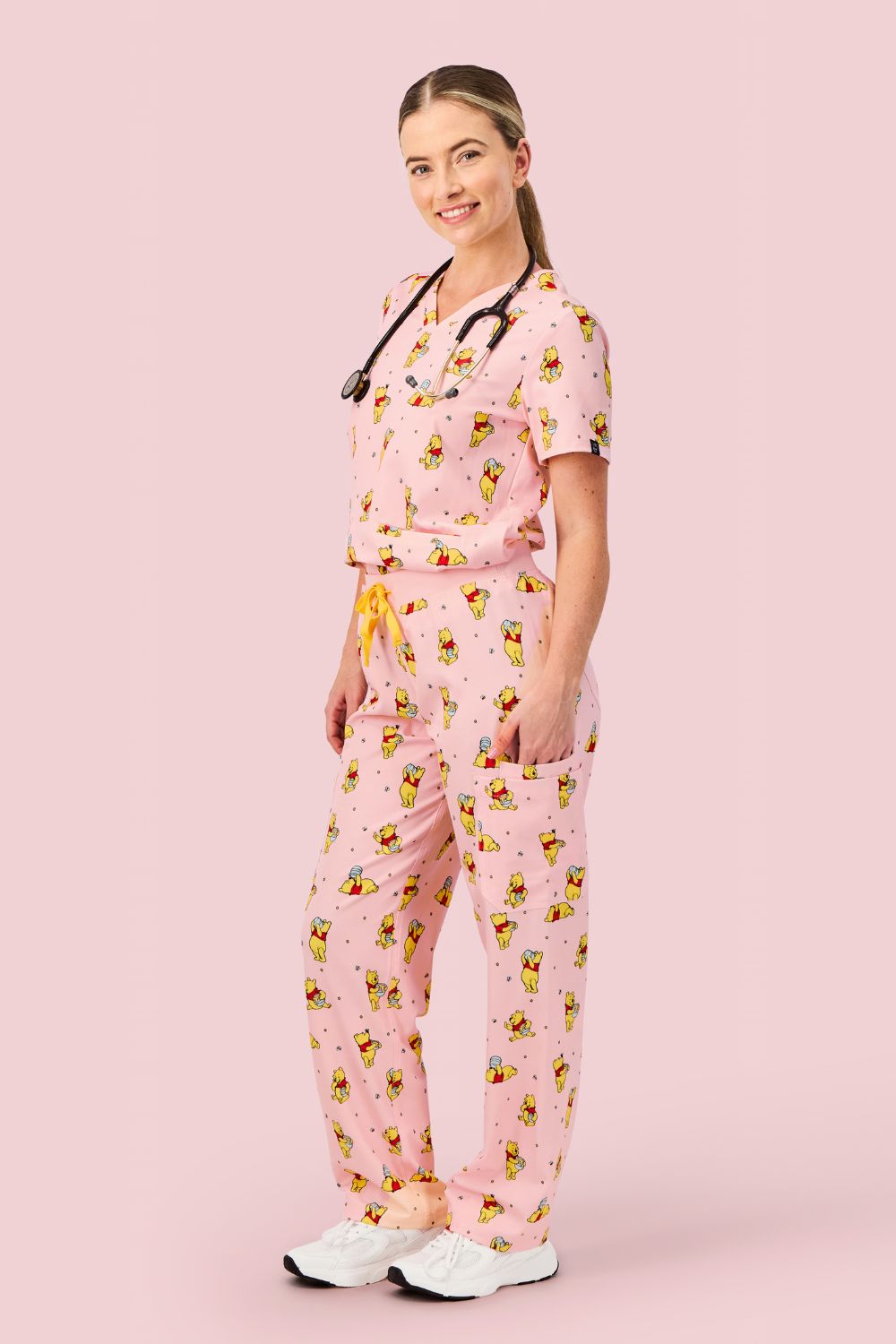 Disney’s Winnie the Pooh Women’s 3-Pocket Scrub Top, Honey Pot