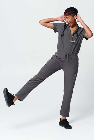 Healthcare worker wearing a scrub uniform in Dark Shadow Gray