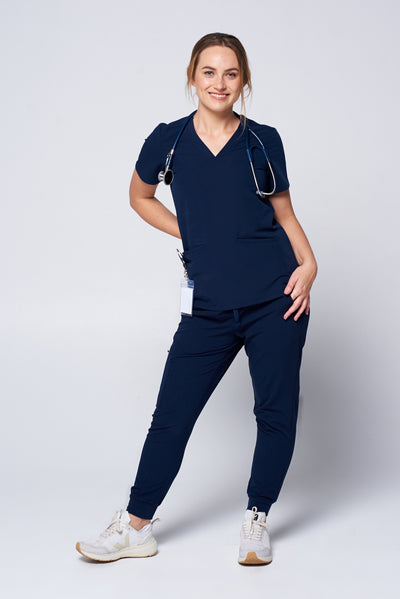 Nurse wearing a navy scrub uniform