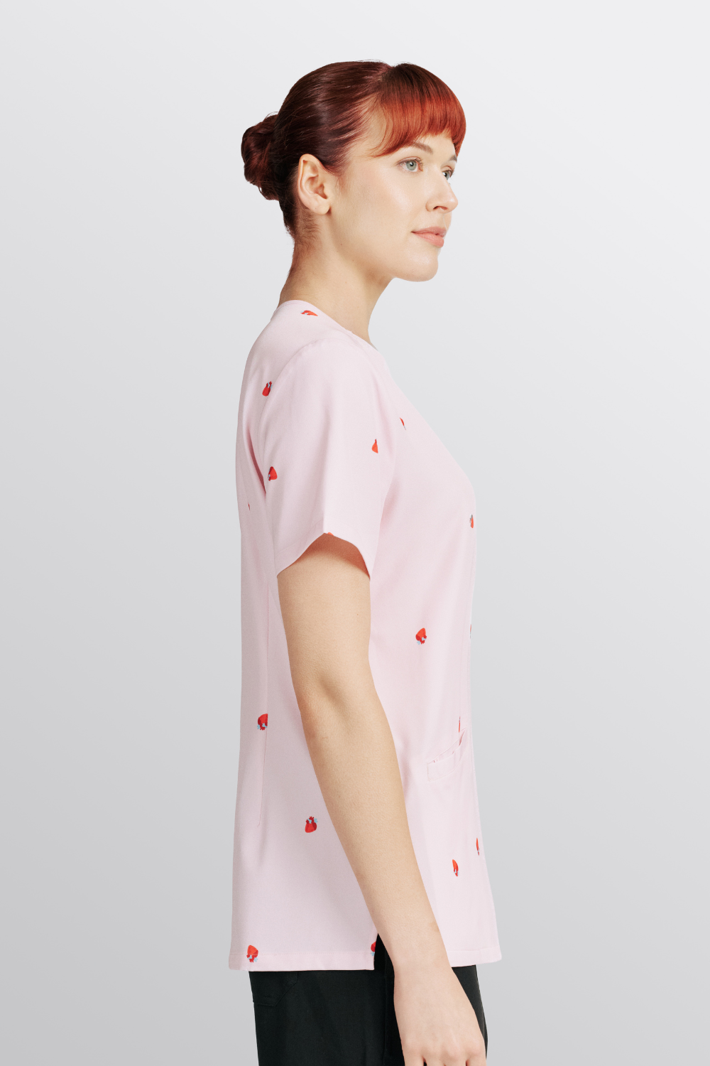 A Vet Nurse wearing the Lub Dub Women's 3-Pocket Scrub top, showing the v-neckline and short sleeve logo detail.