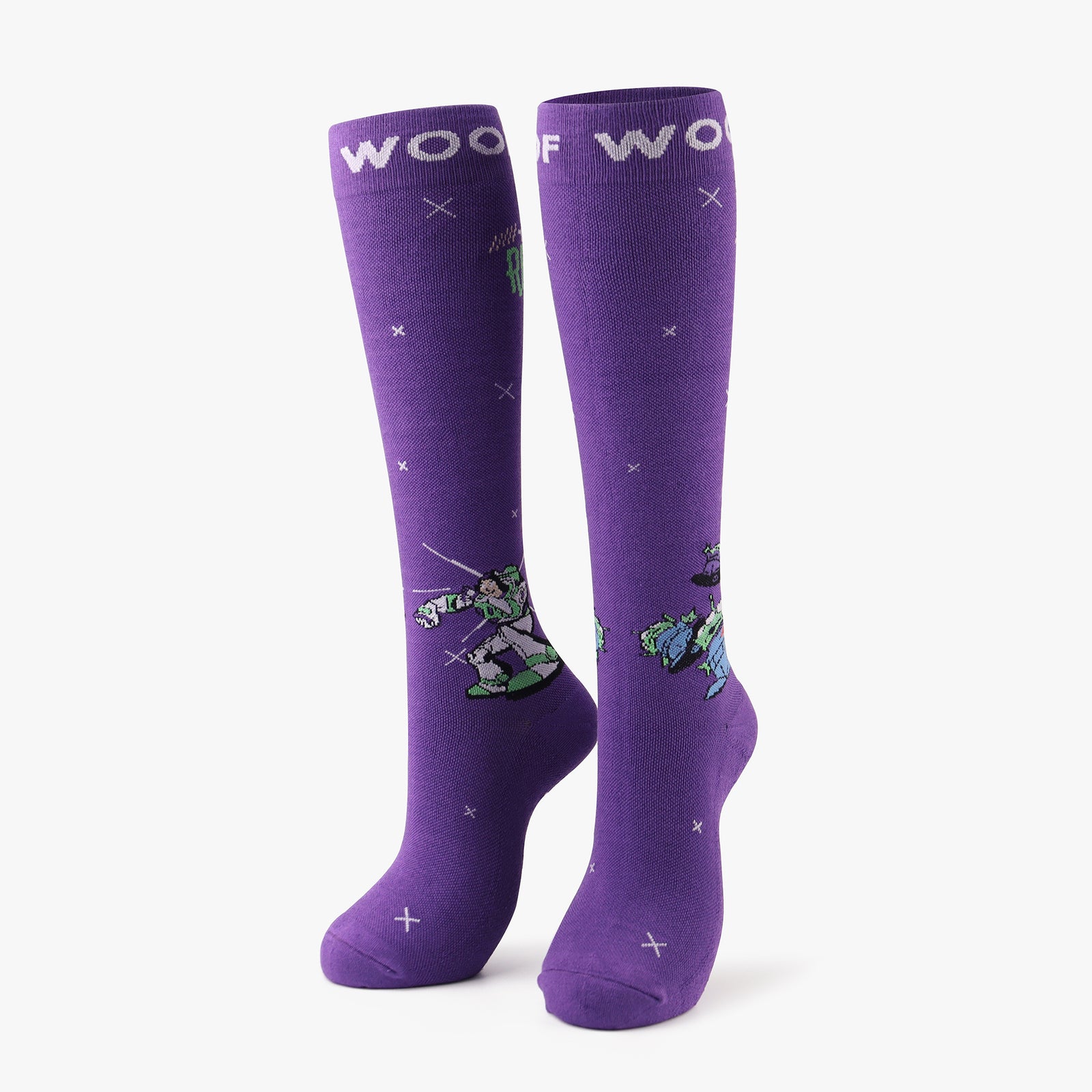 A pair of vibrant purple compression socks featuring Buzz Lightyear and Little Green Men from Disney and Pixar’s Toy Story. 