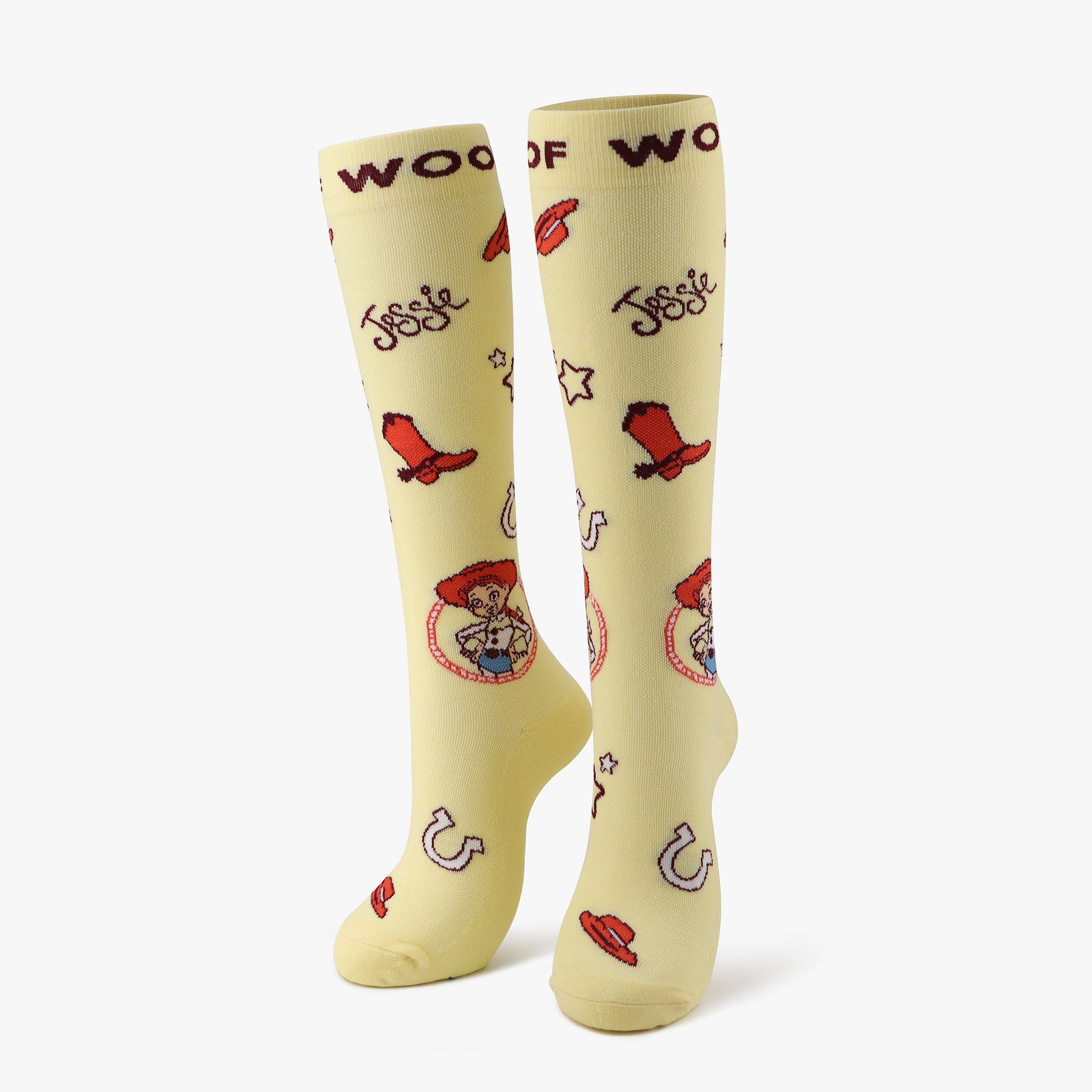 A pair of pale yellow compression socks featuring Jessie from Disney and Pixar’s Toy Story. 