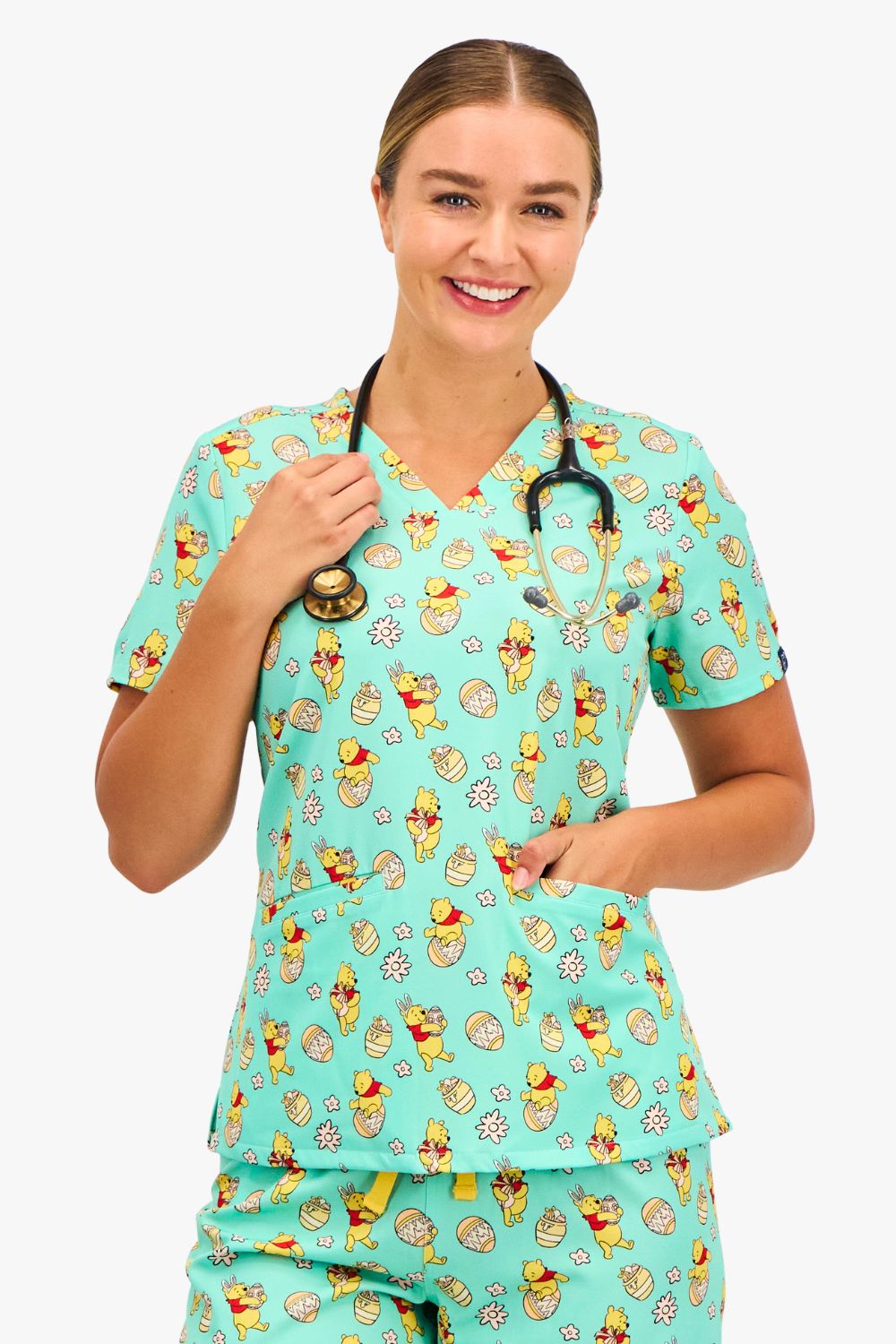 Disney’s Winnie the Pooh Women’s 3-Pocket Scrub Top, Easter Egg Hunt