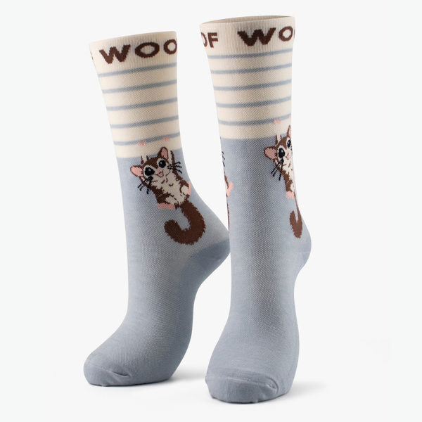Pair of blue Bamboo Crew Compression Socks with sugar glider design and striped cuffs on a plain background.