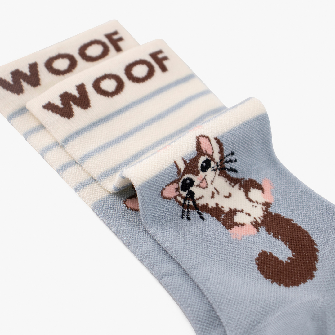 Folded view showing cute sugar glider illustration on blue bamboo crew compression socks with sugar glider design.