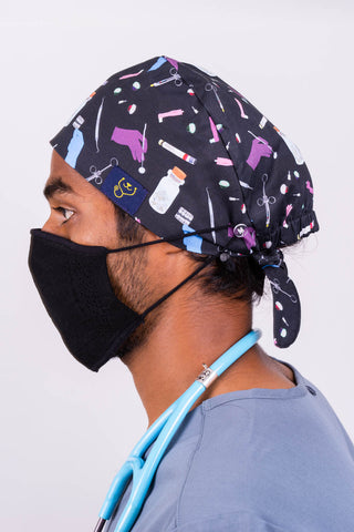 A Doctor Wearing a Dr. Woof Sugar Skulls Anesthesia Surgical Scrub Cap 