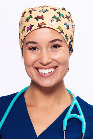 A Vet wearing a Dr. Woof Sea Turtle Surgical Scrub Cap Tie Back