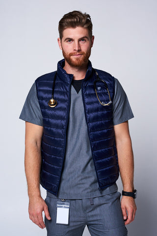 [Navy] Nurse wearing the Dr. Woof Apparel Men's Puffer Vest 