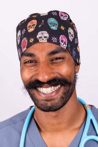 A Doctor Wearing a Dr. Woof Sugar Skulls Anesthesia Surgical Scrub Cap Tie Back