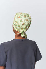 A Dentist Wearing a Dr. Woof Little Sloth Surgical Scrub Cap 